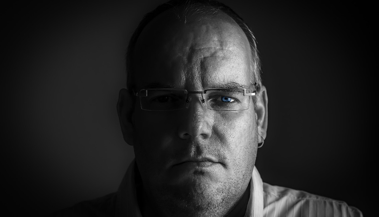 Man looking glum in black and white
